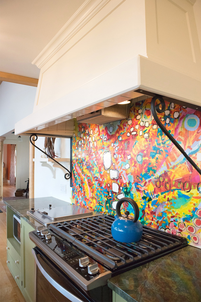 Annapolis Valley artist Alex Porter was commissioned to create an original art piece for the panel behind the range in this kitchen in Hunts Point, N.S.  Photo: Deborah Nicholson Design