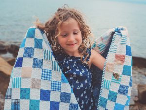 Little girl with Quilt