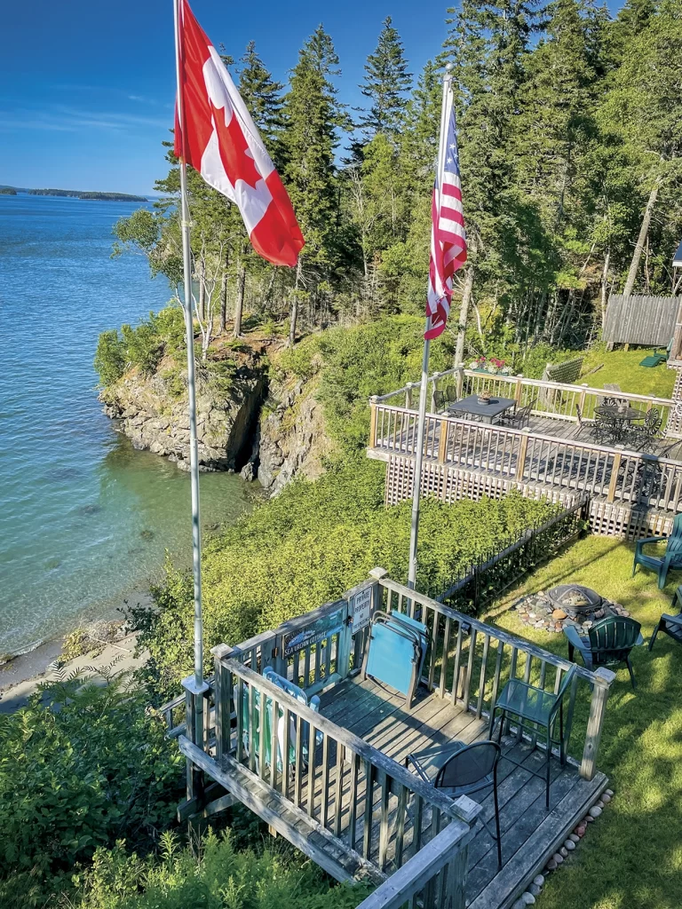 Canadian and American flags on Dennis and Margaret Haire’s cottage property.
